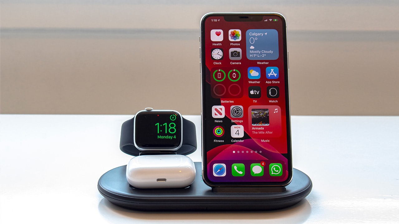 Image: Apple Watch, AirPods and iPhone on wireless charging pad.
