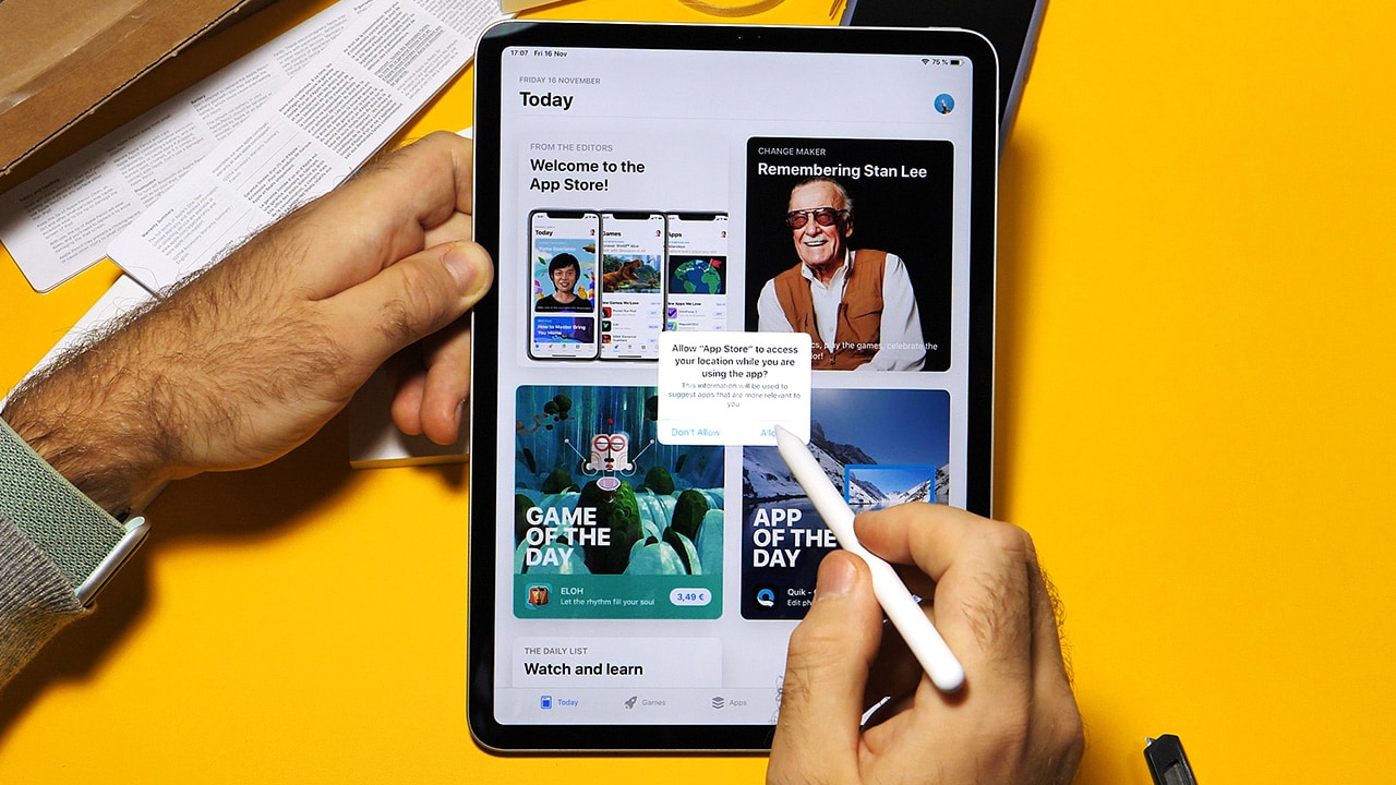 Image: Person using iPad with an Apple Pencil.