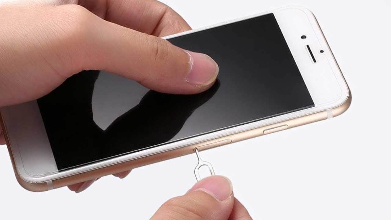 Image: How to remove the sim card from your iPhone.